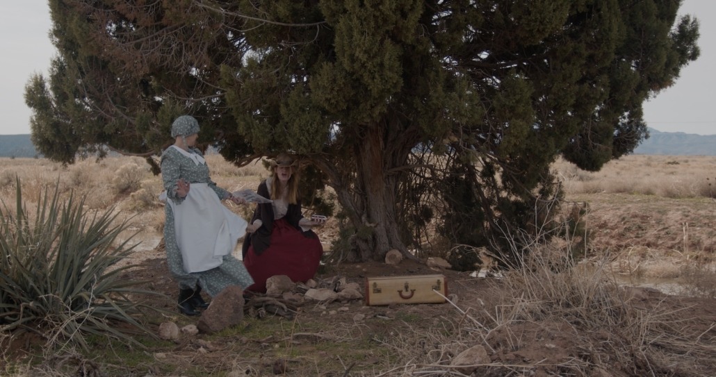 emma and lily dance by a tree