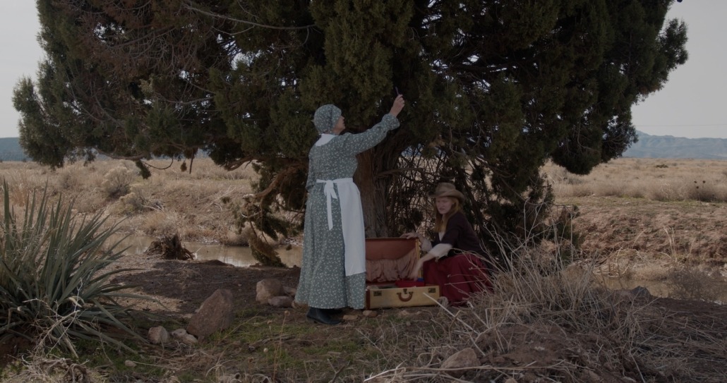 emma looks for phone signal while lily looks in suitcase