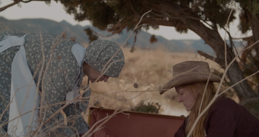 emma and lily look in a suitcase