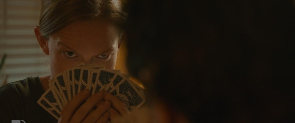 lily hides behind her cards